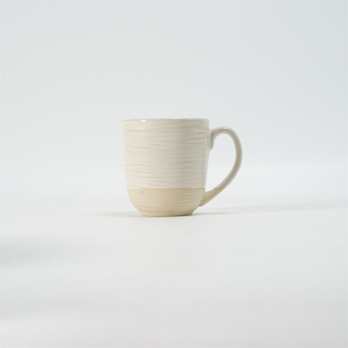Hancai Embossed reactive glaze mug with unglaze half-part