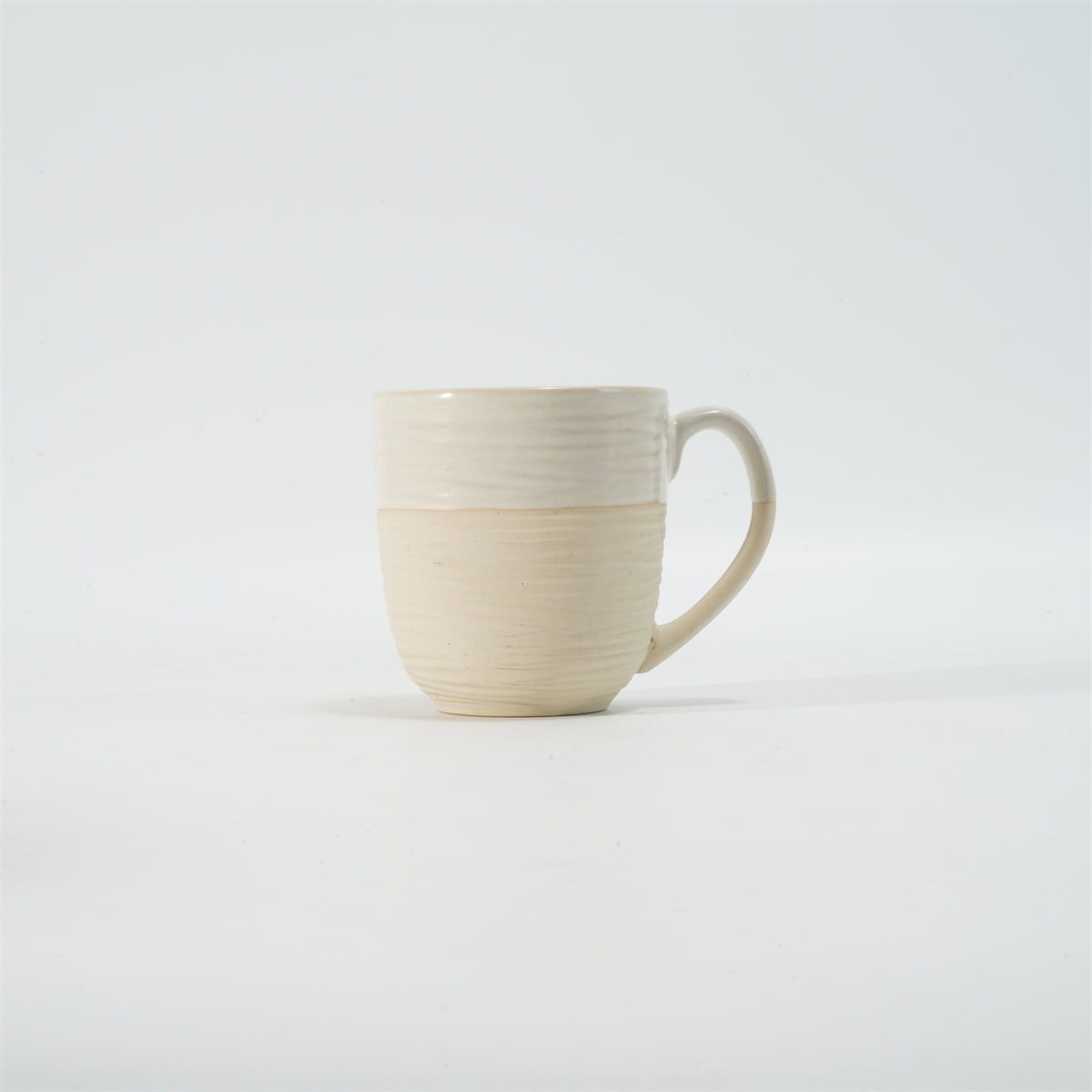 Hancai Embossed reactive glaze mug with unglaze half-part