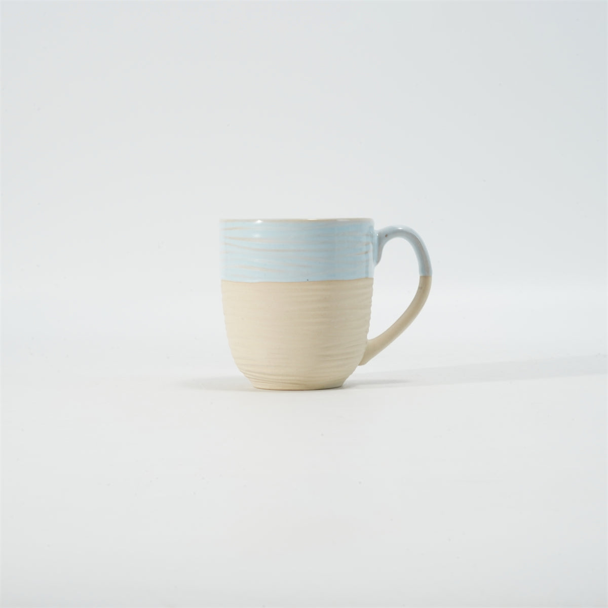 Hancai Embossed reactive glaze mug with unglaze half-part